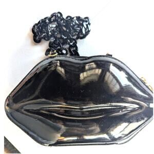 Betsy Johnson lips purse
